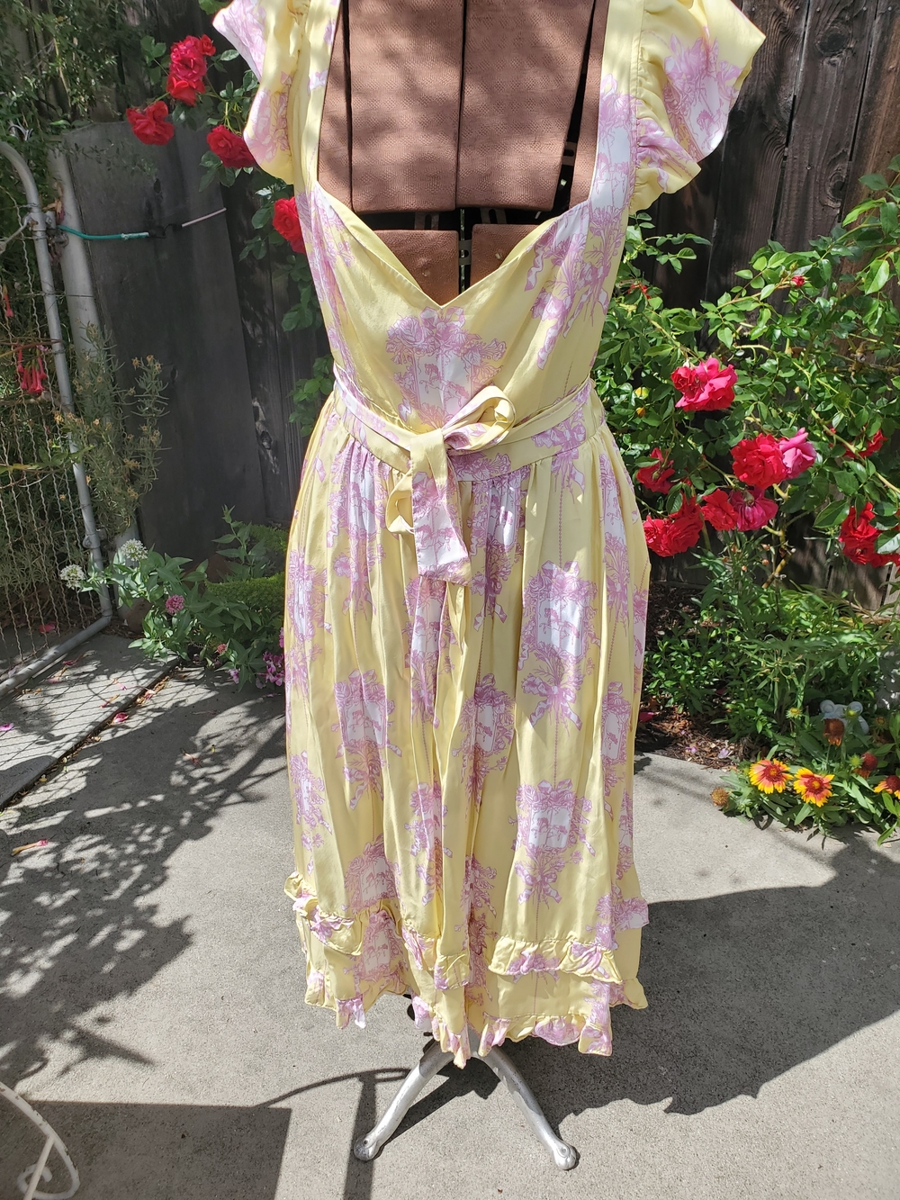 Poppy Angeloff Yellow and Pink Floral Midi Dress with Tie Waist and Ruffle Hem